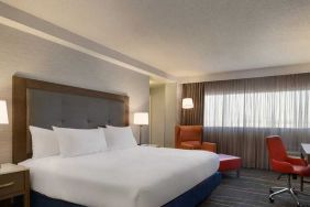 comfortable king room with work desk and lounger at DoubleTree by Hilton Hotel Albuquerque.