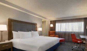 comfortable king room with work desk and lounger at DoubleTree by Hilton Hotel Albuquerque.