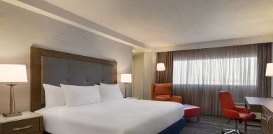 comfortable king room with work desk and lounger at DoubleTree by Hilton Hotel Albuquerque.