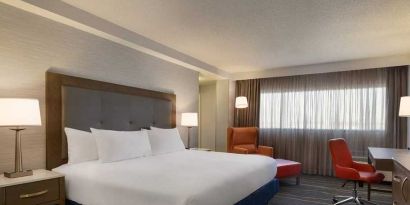 comfortable king room with work desk and lounger at DoubleTree by Hilton Hotel Albuquerque.