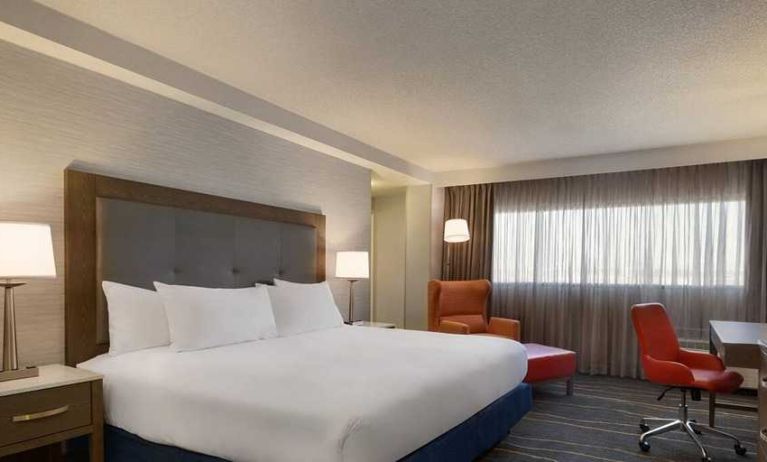 comfortable king room with work desk and lounger at DoubleTree by Hilton Hotel Albuquerque.