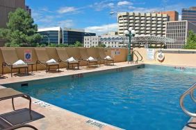 luxurious outdoor pool surrounded by sunbeds at DoubleTree by Hilton Hotel Albuquerque.