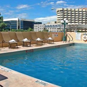 luxurious outdoor pool surrounded by sunbeds at DoubleTree by Hilton Hotel Albuquerque.