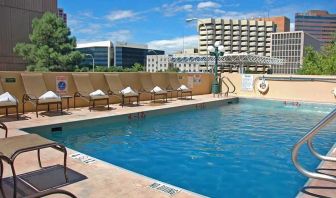 luxurious outdoor pool surrounded by sunbeds at DoubleTree by Hilton Hotel Albuquerque.