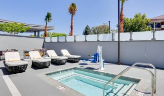 small outdoor dipping pool in beautiful surroundings with sun beds at Hampton Inn Irvine Spectrum Lake Forest.