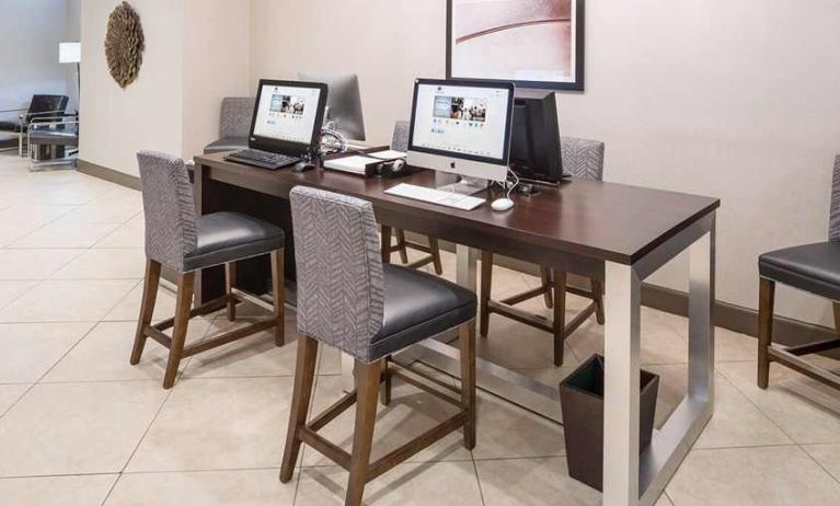 business center and coworking space equipped with work desks, PC, internet, and printers at DoubleTree by Hilton Hotel Wilmington.