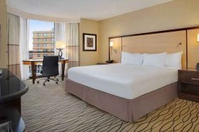 spacious king room with TV and work area ideal for working remotely at Hilton Rosemont/Chicago O'Hare.