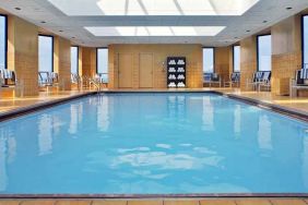 lovely indoor pool with surround seating area at Hilton Rosemont/Chicago O'Hare.