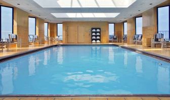 lovely indoor pool with surround seating area at Hilton Rosemont/Chicago O'Hare.