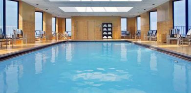 lovely indoor pool with surround seating area at Hilton Rosemont/Chicago O'Hare.