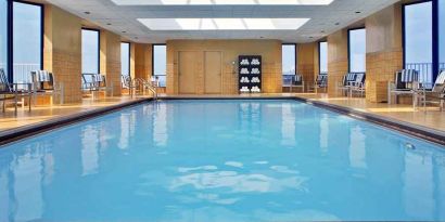 lovely indoor pool with surround seating area at Hilton Rosemont/Chicago O'Hare.