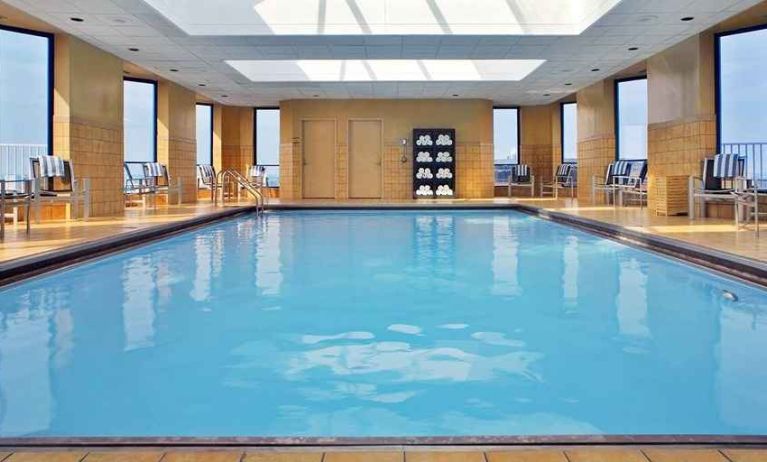 lovely indoor pool with surround seating area at Hilton Rosemont/Chicago O'Hare.