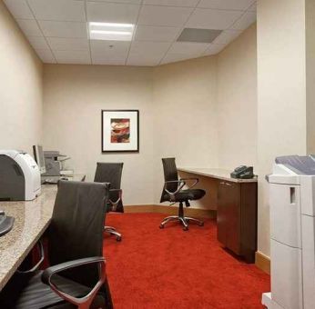 dedicated business center with work desk, PC, internet, and printers at Hilton Rosemont/Chicago O'Hare.