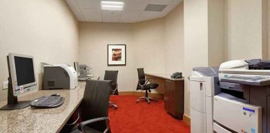 dedicated business center with work desk, PC, internet, and printers at Hilton Rosemont/Chicago O'Hare.