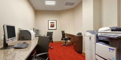 dedicated business center with work desk, PC, internet, and printers at Hilton Rosemont/Chicago O'Hare.