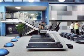 well equipped fitness center with treadmills and weights at Palmer House a Hilton Hotel.