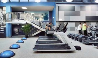 well equipped fitness center with treadmills and weights at Palmer House a Hilton Hotel.