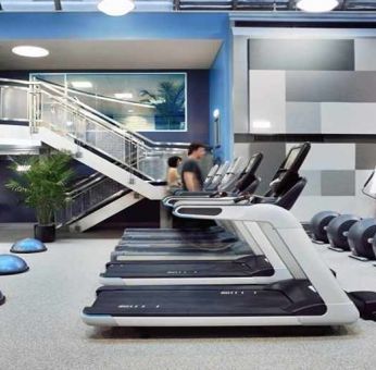 well equipped fitness center with treadmills and weights at Palmer House a Hilton Hotel.