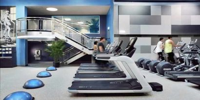 well equipped fitness center with treadmills and weights at Palmer House a Hilton Hotel.