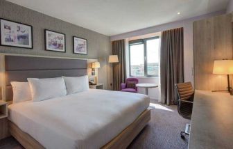 King guestroom with working station at the Hilton Garden Inn Dublin Custom House.