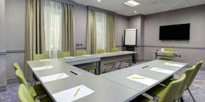 Small meeting room with u shape table at the Hilton Garden Inn Dublin Custom House.