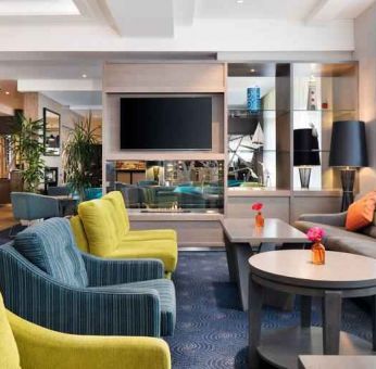 Comfortable lobby workspace with sofas at the Hilton Garden Inn Dublin Custom House.