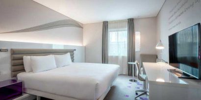 King guestroom with working station at the Morrison, a DoubleTree by Hilton Hotel.