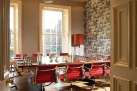 Elegant meeting room with square table at the Morrison, a DoubleTree by Hilton Hotel.