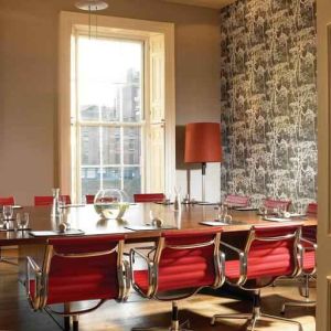 Elegant meeting room with square table at the Morrison, a DoubleTree by Hilton Hotel.