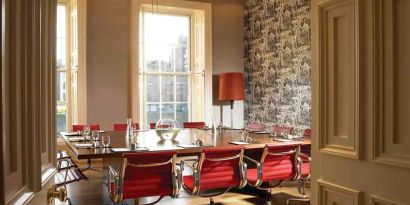 Elegant meeting room with square table at the Morrison, a DoubleTree by Hilton Hotel.