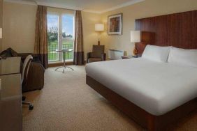 King bedroom with desk at the Hilton Belfast Templepatrick Golf & Country Club.