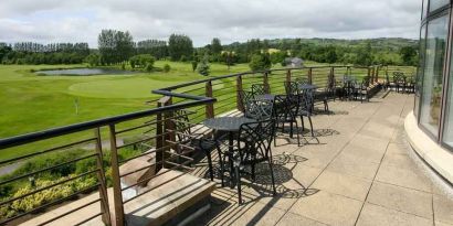 Outdoor terrace overlooking the golf field at the Hilton Belfast Templepatrick Golf & Country Club.