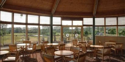 Restaurant area with view at the Hilton Belfast Templepatrick Golf & Country Club.