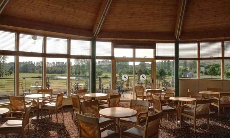 Restaurant area with view at the Hilton Belfast Templepatrick Golf & Country Club.