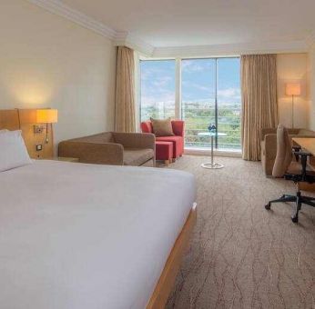 Large king suite with working station at the Hilton Dublin Airport.