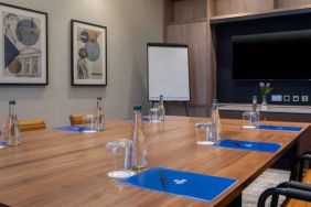 Small meeting room with square table at the Hilton Dublin Airport.