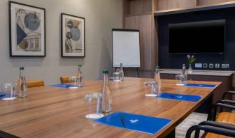 Small meeting room with square table at the Hilton Dublin Airport.