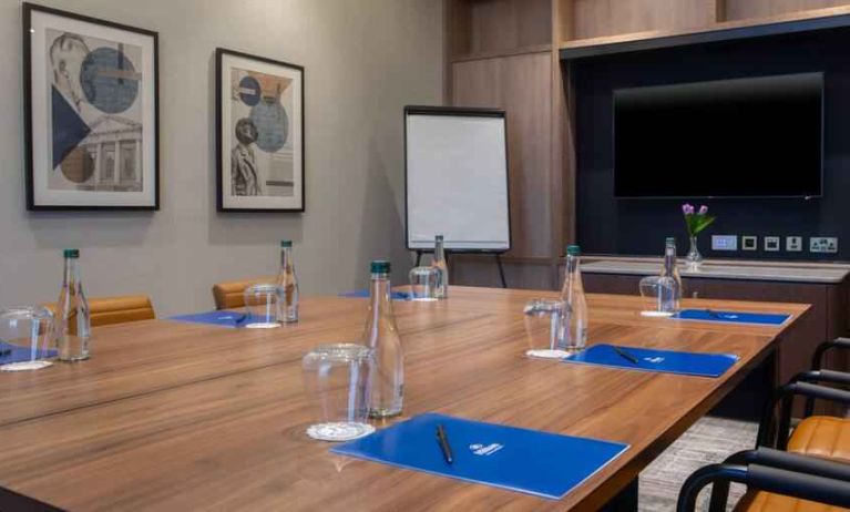 Small meeting room with square table at the Hilton Dublin Airport.