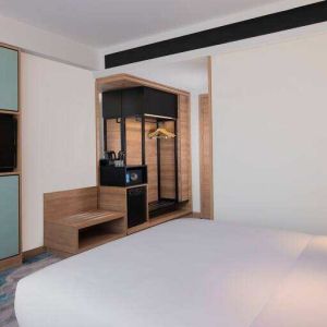 Comfortable king size bed in a king guestroom at the Hilton Garden Inn Jakarta Taman Palem.