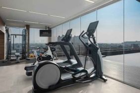 Fitness center with treadmills at the Hilton Garden Inn Jakarta Taman Palem.