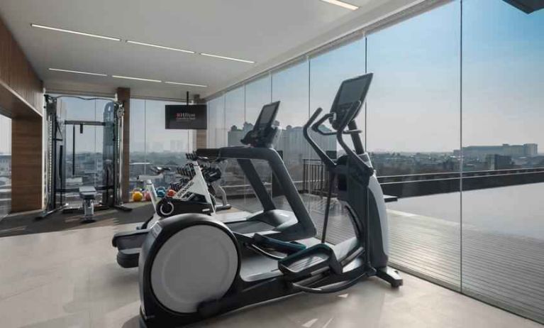 Fitness center with treadmills at the Hilton Garden Inn Jakarta Taman Palem.