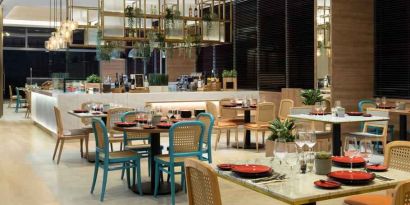 Dining area perfect for co-working at the Hilton Garden Inn Jakarta Taman Palem.