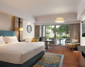 Spacious king bedroom with desk at the Hilton Bali Resort.