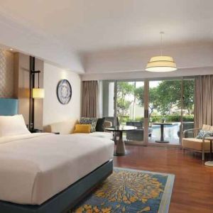 Spacious king bedroom with desk at the Hilton Bali Resort.