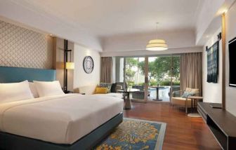 Spacious king bedroom with desk at the Hilton Bali Resort.