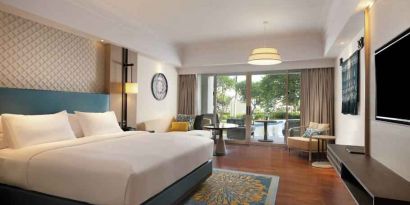 Spacious king bedroom with desk at the Hilton Bali Resort.