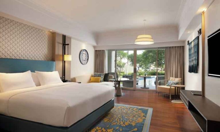 Spacious king bedroom with desk at the Hilton Bali Resort.