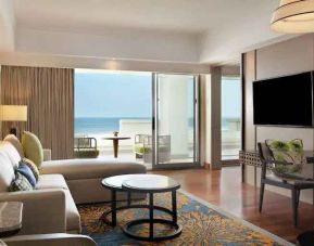 Comfortable living room with working station at the Hilton Bali Resort.
