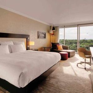 King bedroom with desk at the Hilton Munich Park.