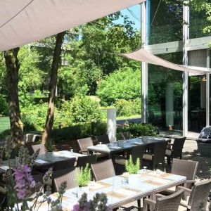 Outdoor patio with garden perfect as workspace at the Hilton Munich Park.